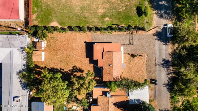 aerial view of a house with a yard