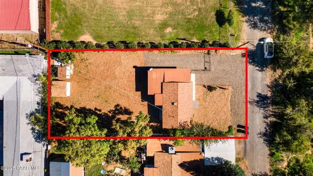 an aerial view of building and yard