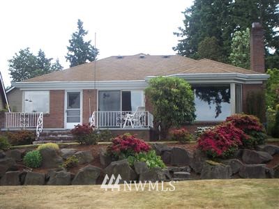 19653 Military Road South SeaTac, WA 98188 - Photo 1 of 1 a front view of a house with a yard