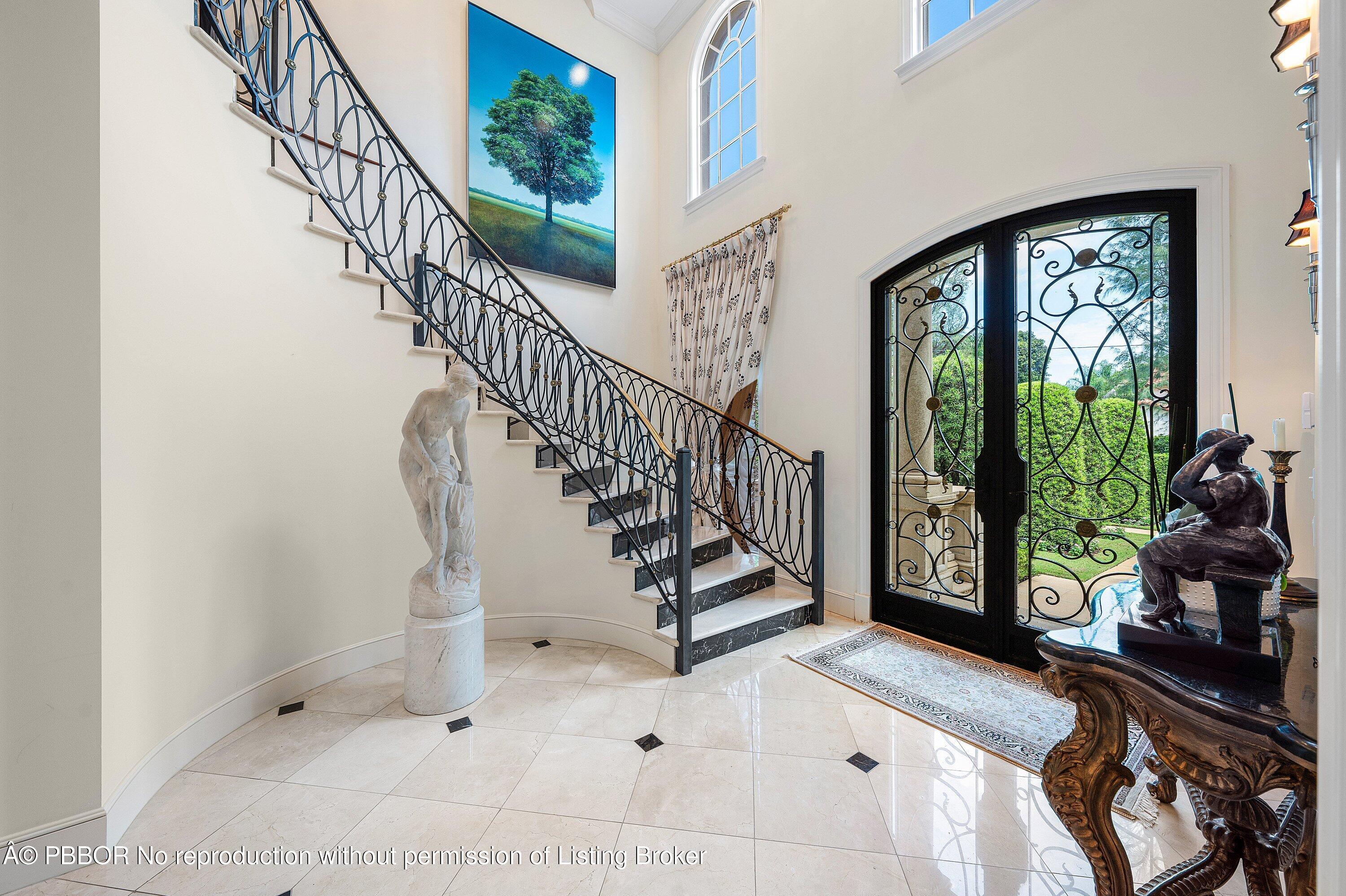 242 Wells Road Palm Beach, FL 33480 - Photo 6 of 54 a view of entryway with wooden floor and a rug