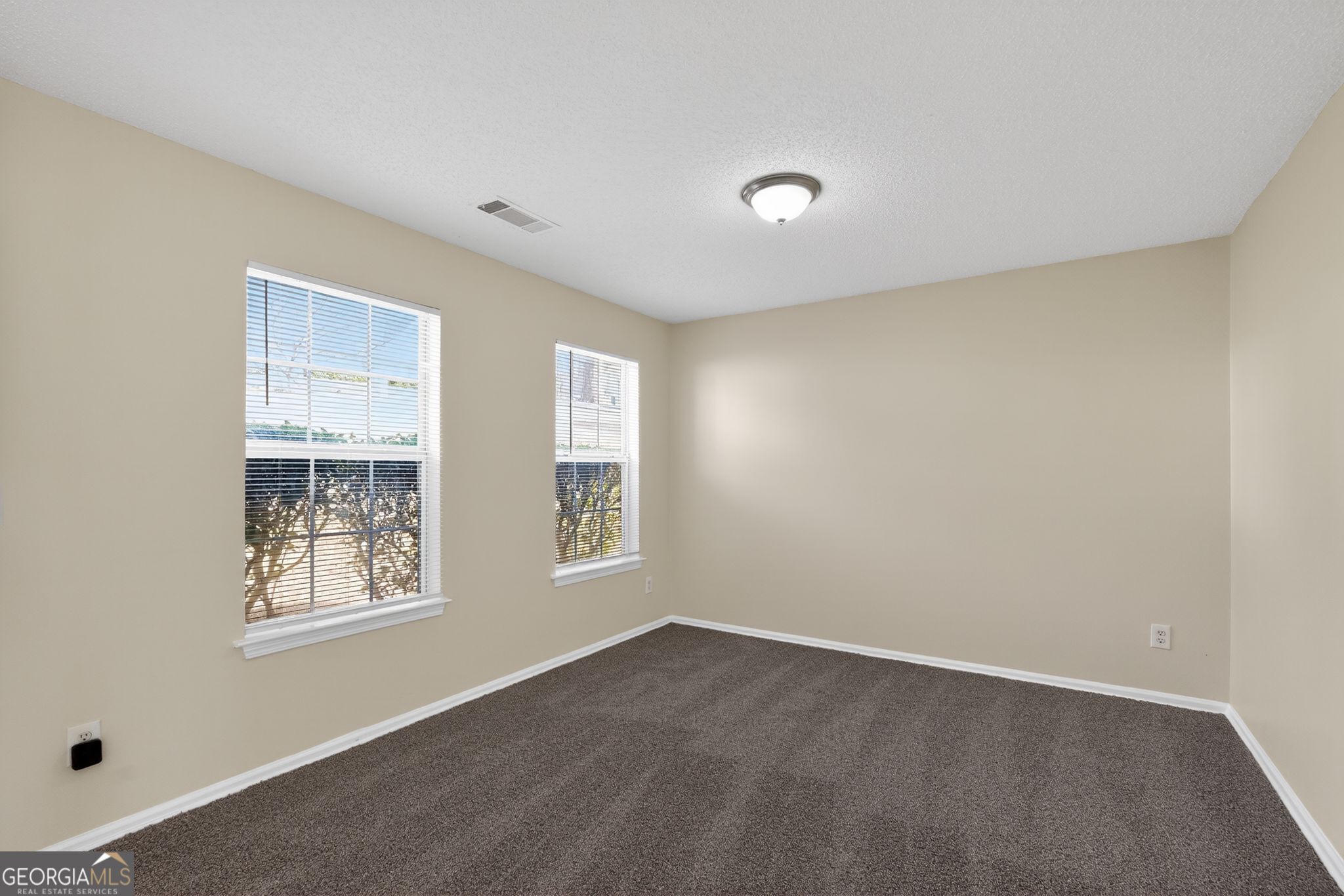 4627 Laura Place Lithonia, GA 30038 - Photo 13 of 33 a view of an empty room with a window