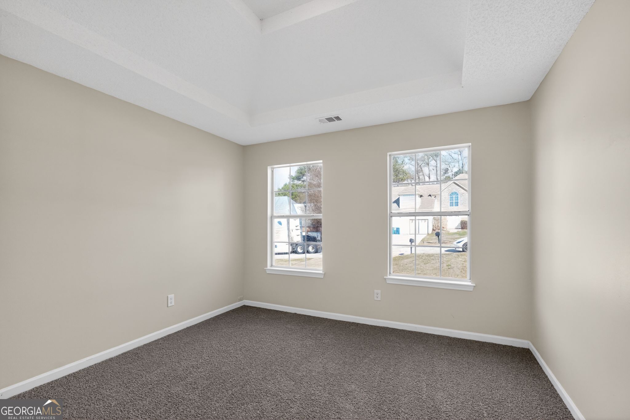 4627 Laura Place Lithonia, GA 30038 - Photo 16 of 33 an empty room with windows