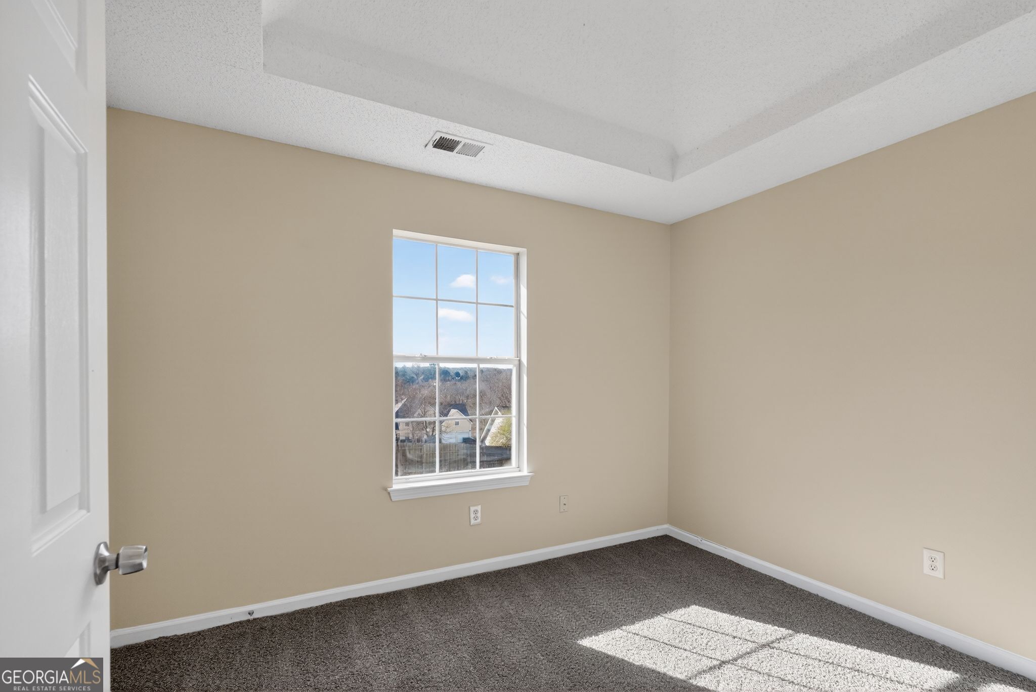 4627 Laura Place Lithonia, GA 30038 - Photo 17 of 33 an empty room with windows