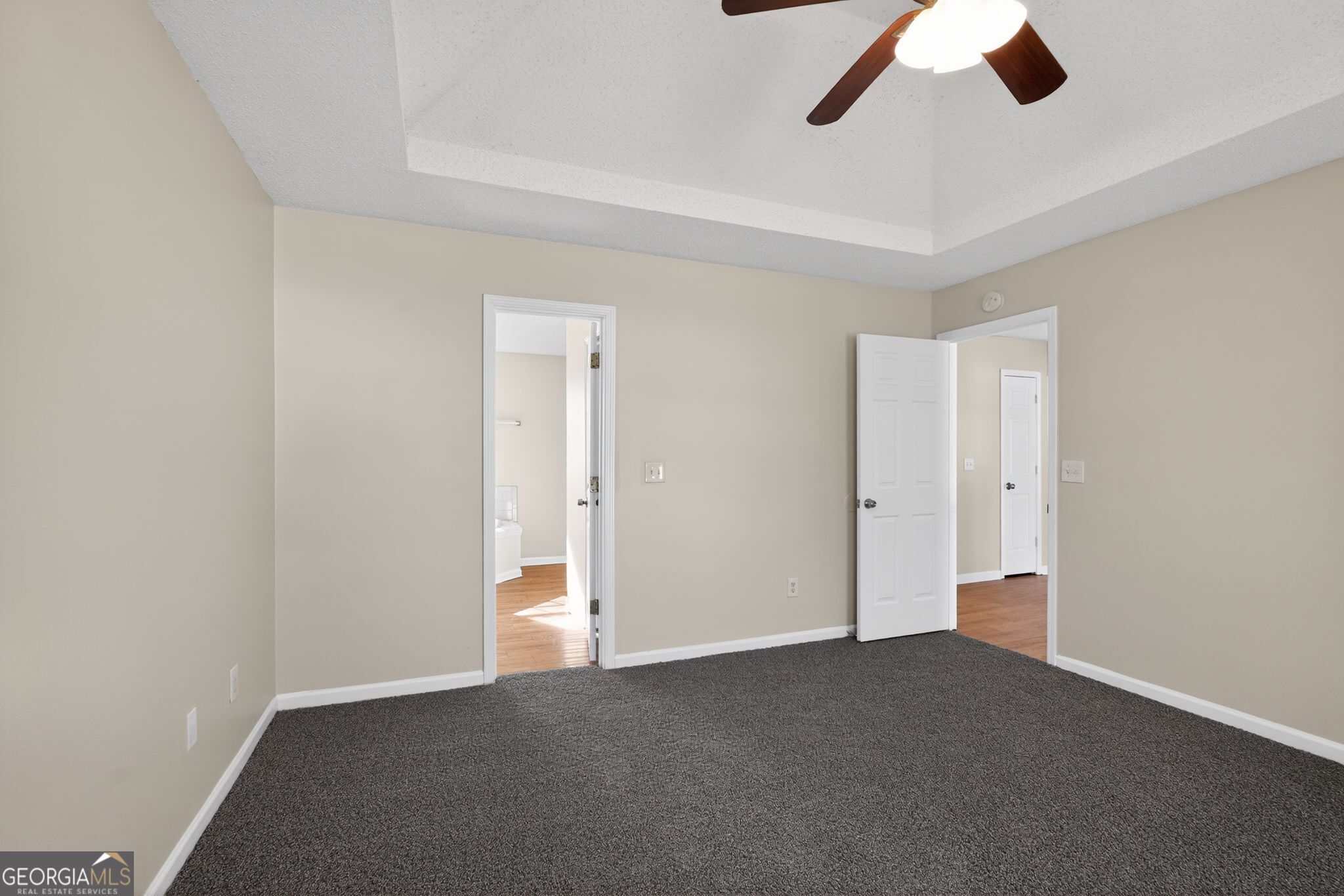 4627 Laura Place Lithonia, GA 30038 - Photo 19 of 33 an empty room with a empty space and a ceiling fan