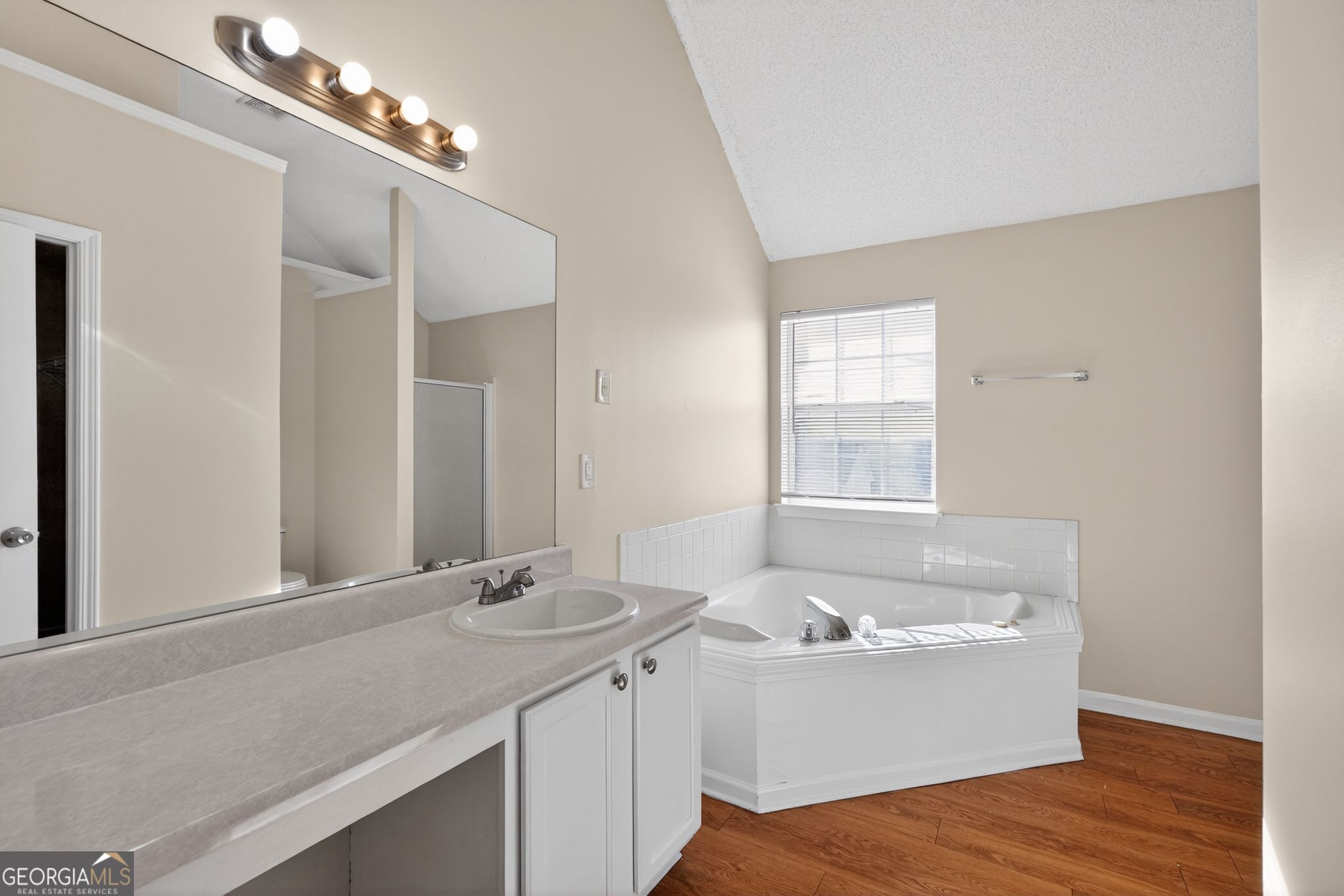 4627 Laura Place Lithonia, GA 30038 - Photo 22 of 33 a bathroom with a bathtub and a sink