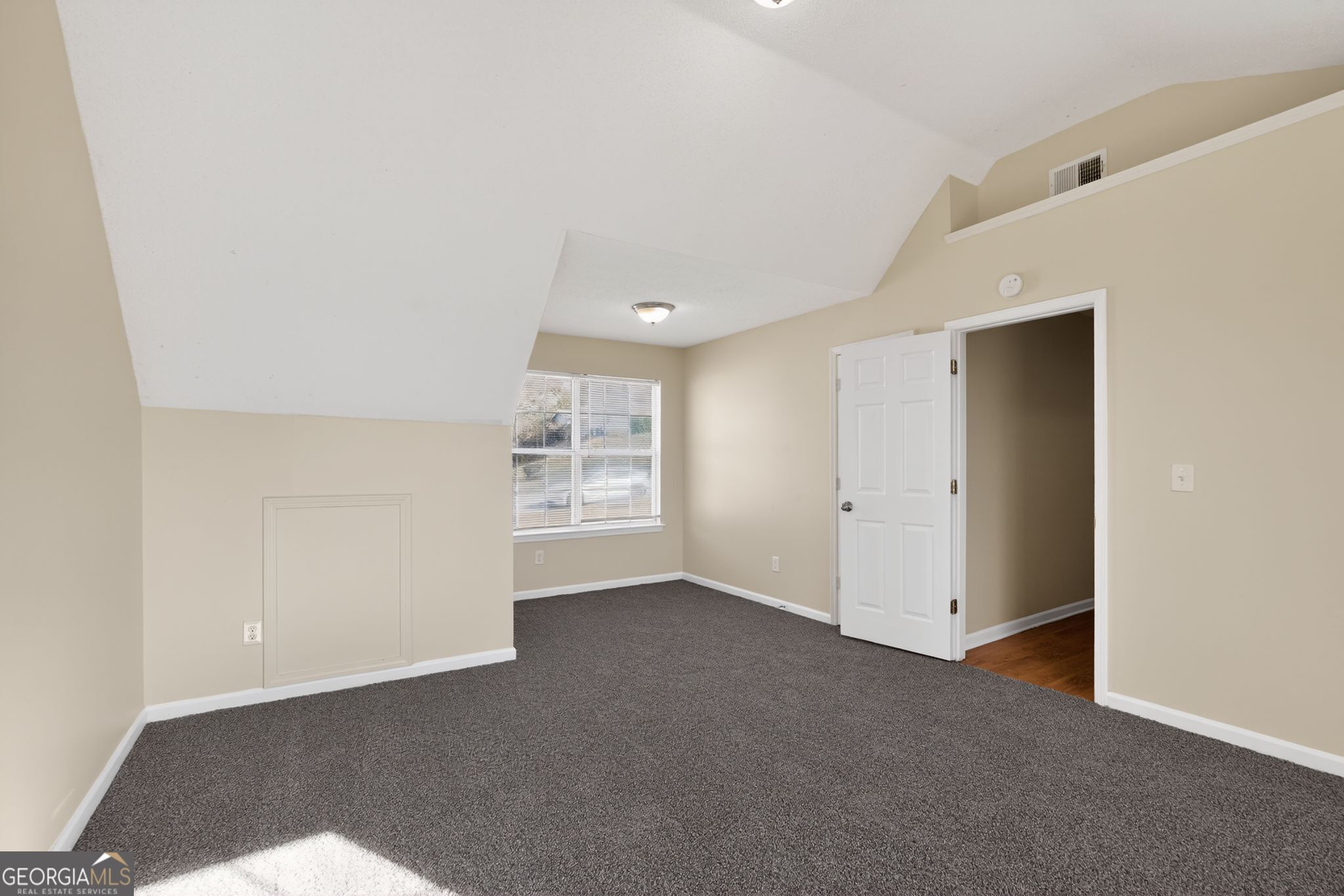 4627 Laura Place Lithonia, GA 30038 - Photo 28 of 33 a view of an empty room with a window