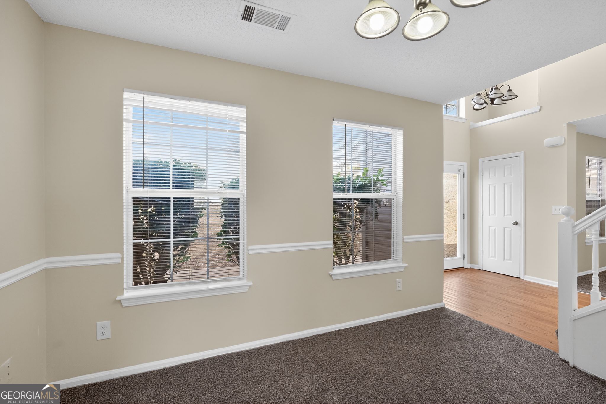 4627 Laura Place Lithonia, GA 30038 - Photo 10 of 33 an empty room with windows