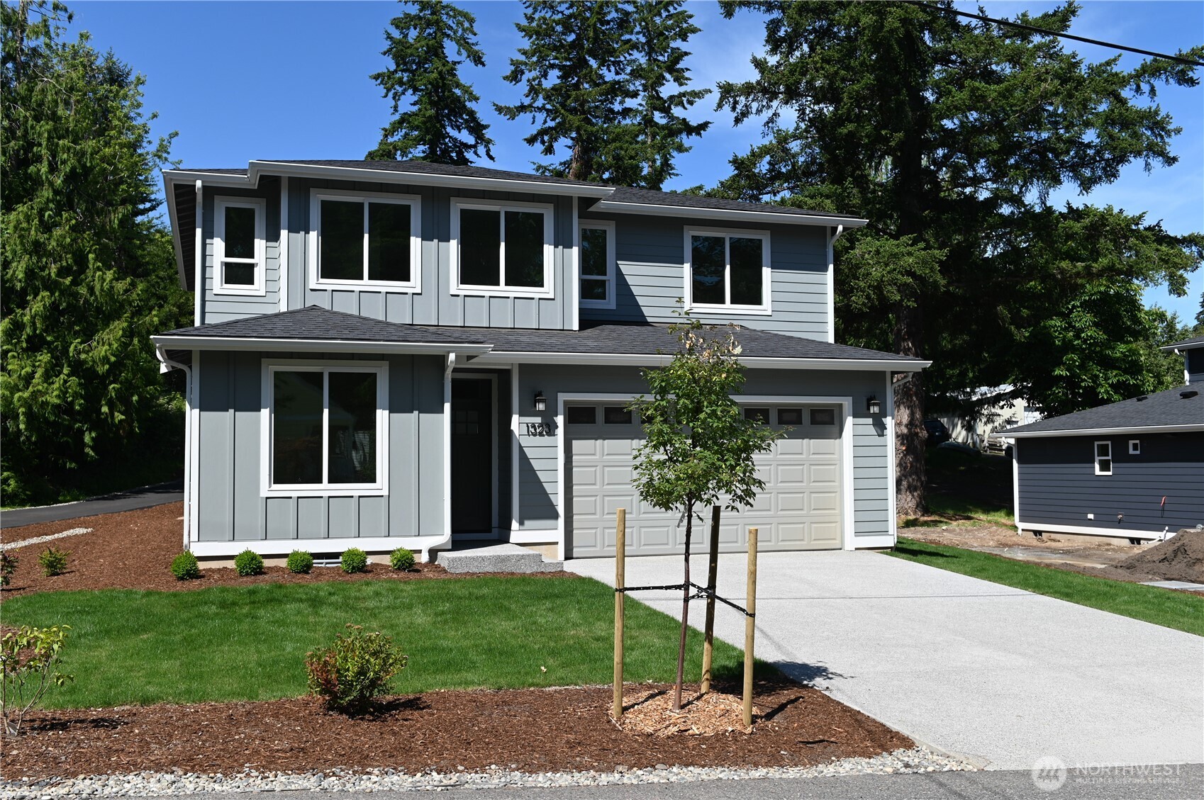 1323 Roland Street Bellingham, WA 98229 - Photo 2 of 16 a front view of a house with a garden