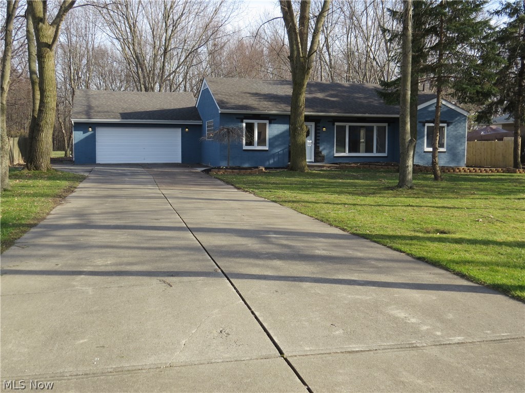 Nice clean Ranch with 4 car tandem garage with rear entrance.