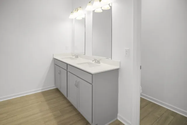 a bathroom with a sink and shower