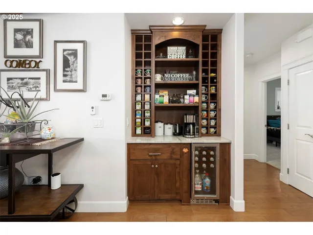 a kitchen area with stainless steel appliances a sink and cabinets