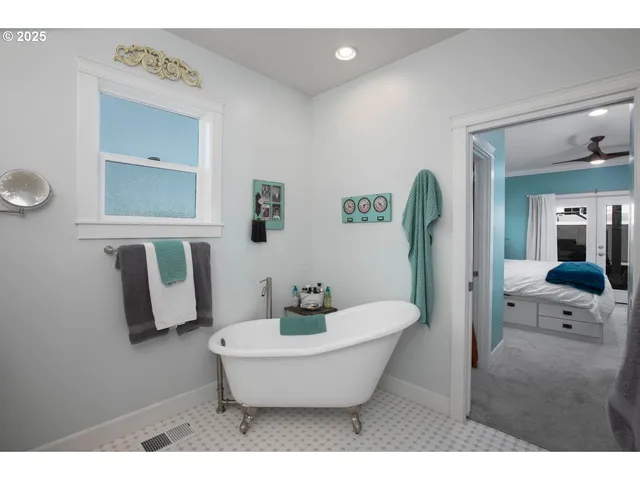 a bathroom with a toilet a sink and bathtub