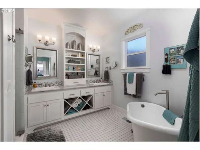 a bathroom with a sink double vanity granite tub and shower