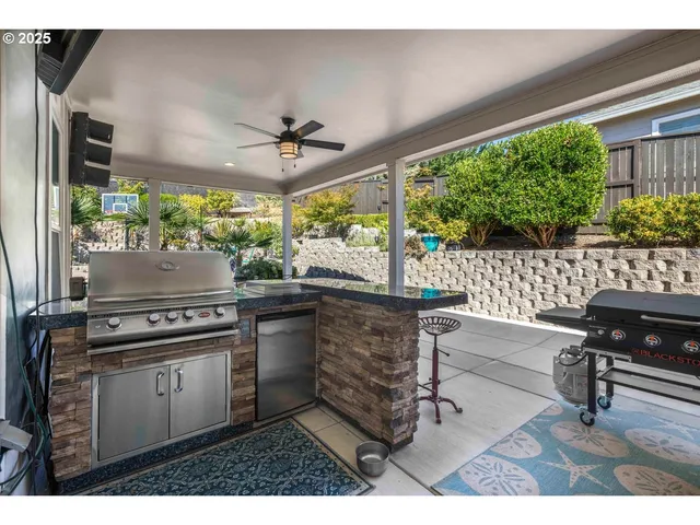 a kitchen with a stove a sink and a refrigerator