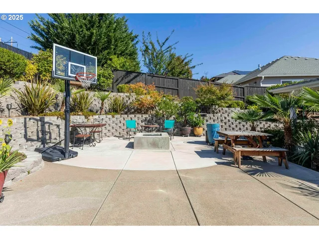 a view of a backyard with sitting area