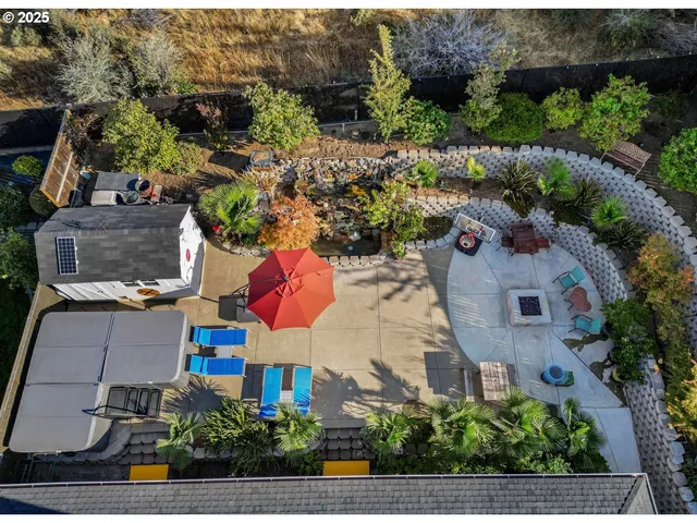 an aerial view of houses with yard