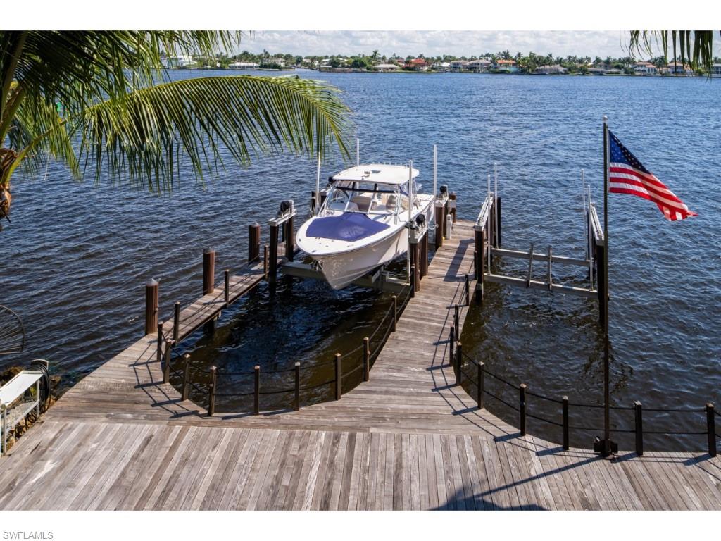 980 Aqua Circle Naples, FL 34102 - Photo 15 of 19 a view of a backyard with sitting area
