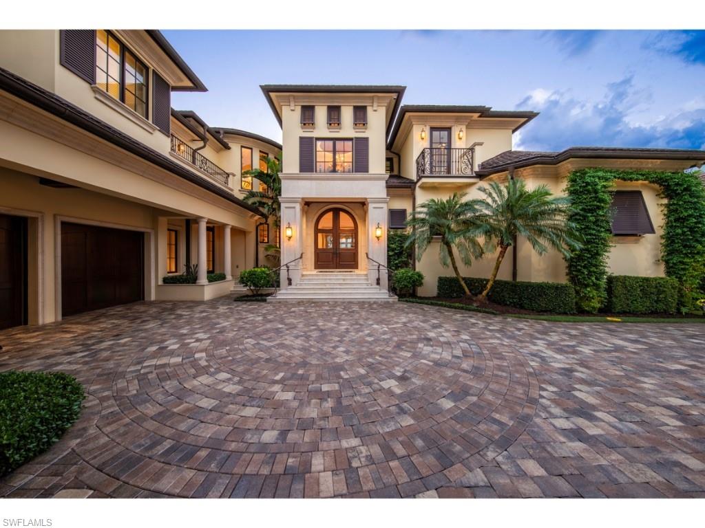 980 Aqua Circle Naples, FL 34102 - Photo 16 of 19 a front view of a house with garden