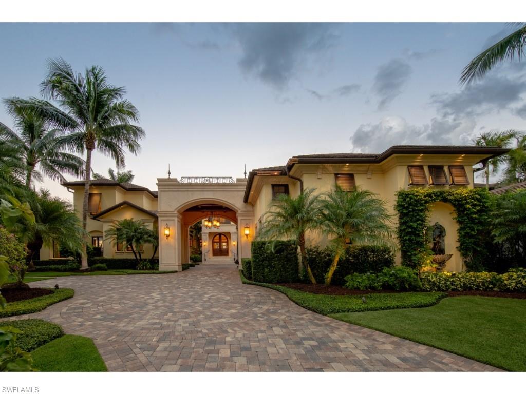 980 Aqua Circle Naples, FL 34102 - Photo 18 of 19 a front view of a house with garden