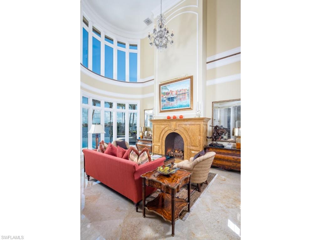 980 Aqua Circle Naples, FL 34102 - Photo 4 of 19 a living room with furniture and a fireplace