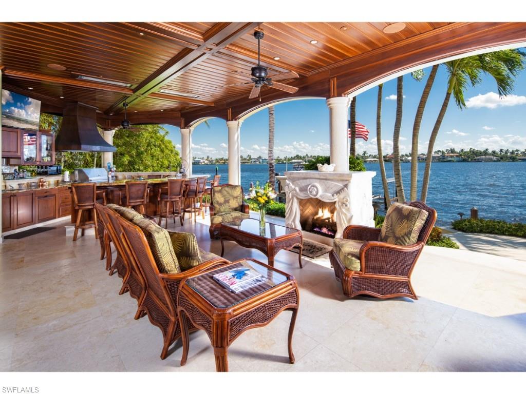 980 Aqua Circle Naples, FL 34102 - Photo 5 of 19 a outdoor living space with furniture and outdoor view