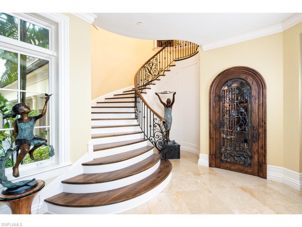 980 Aqua Circle Naples, FL 34102 - Photo 7 of 19 a view of entryway and hall with wooden floor