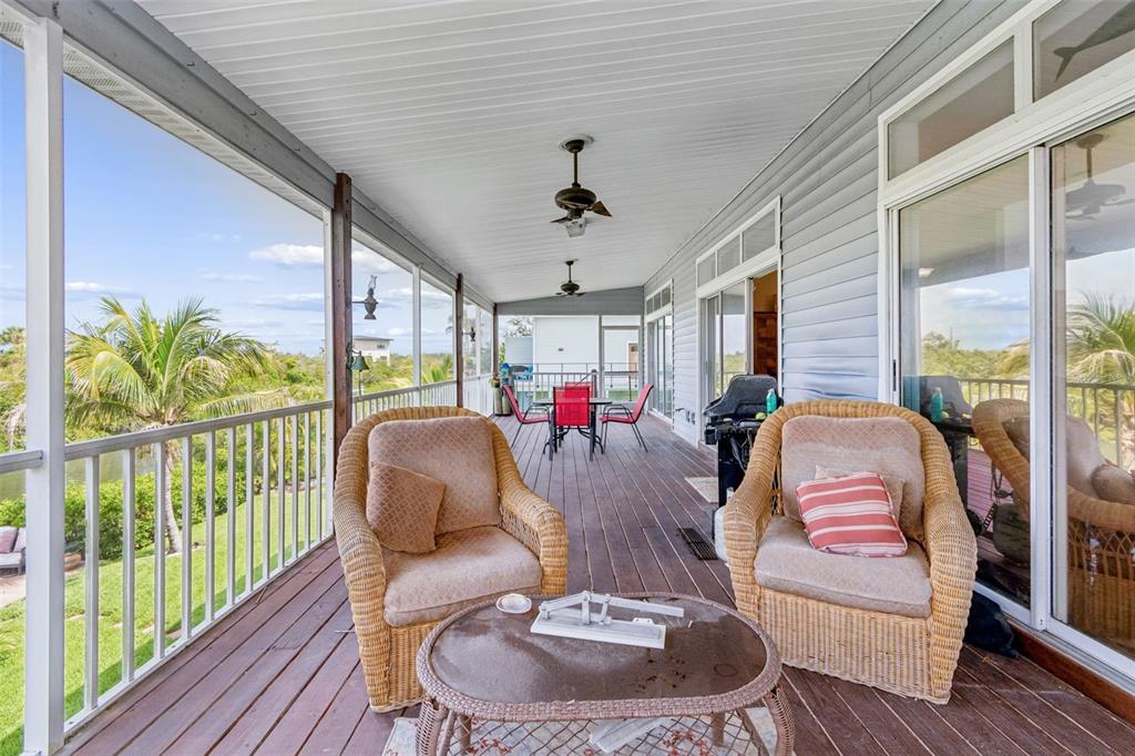 119 Burns Road Terra Ceia, FL 34250 - Photo 66 of 100 a living room with furniture and a large window