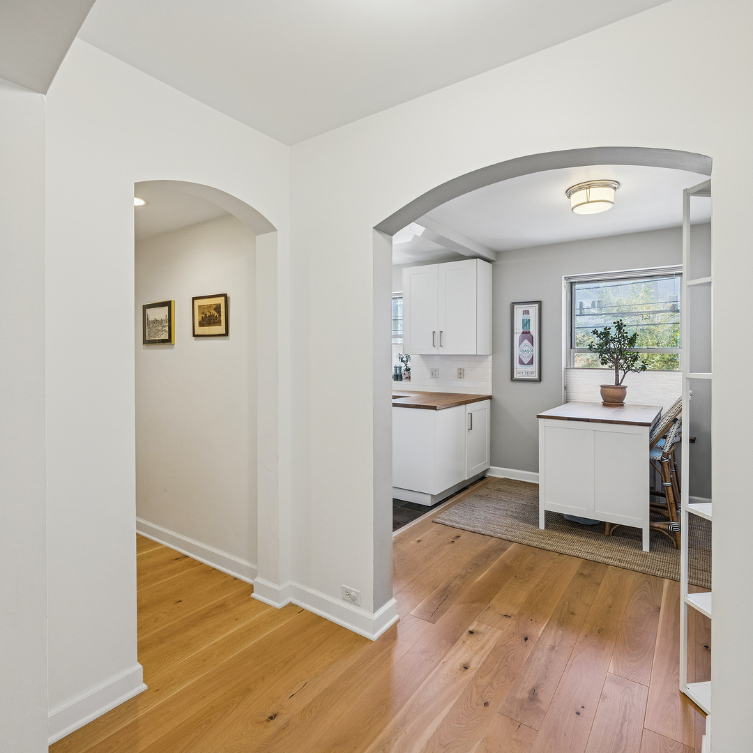4929 North Wolcott Avenue, Unit 1A Chicago, IL 60640 - Photo 2 of 15 a view of a kitchen with furniture and wooden floor