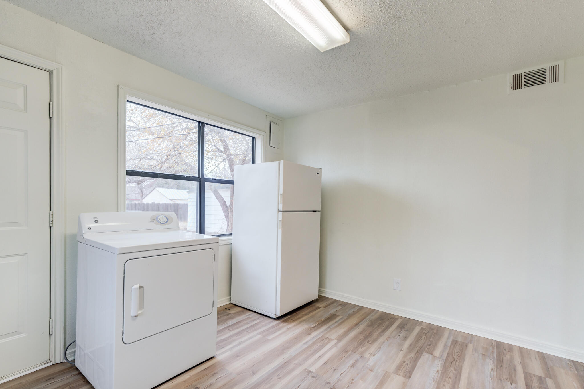 3318 36th Street Lubbock, TX 79413 - Photo 12 of 22 a utility room with dryer and washer