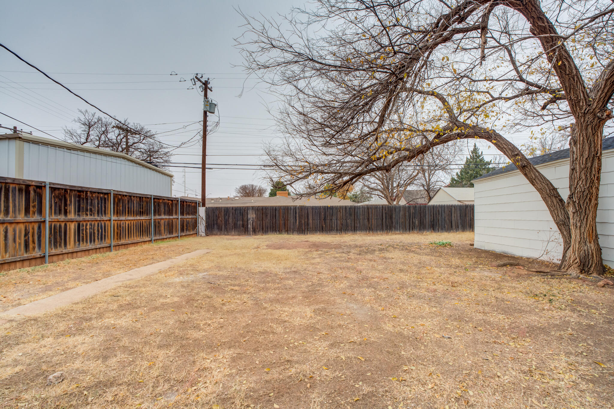 3318 36th Street Lubbock, TX 79413 - Photo 21 of 22 a view of a backyard of the house