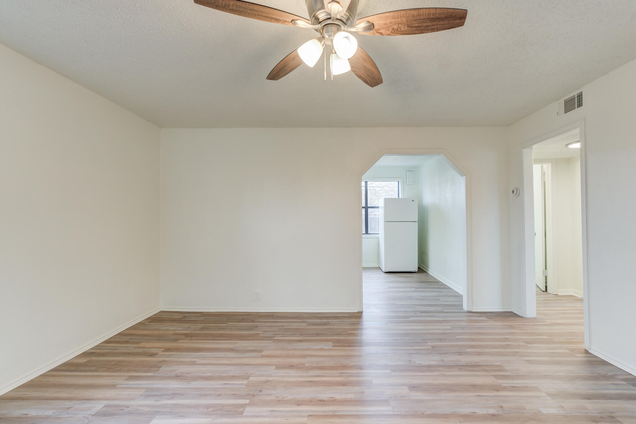 3318 36th Street Lubbock, TX 79413 - Photo 5 of 22 a view of empty room with wooden floor