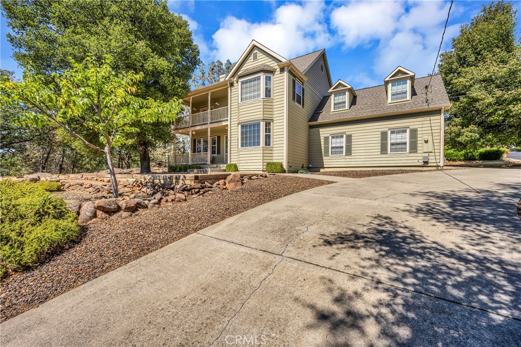 18420 Park Point Court Hidden Valley Lake, CA 95467 - Photo 1 of 44 a front view of a house with a yard