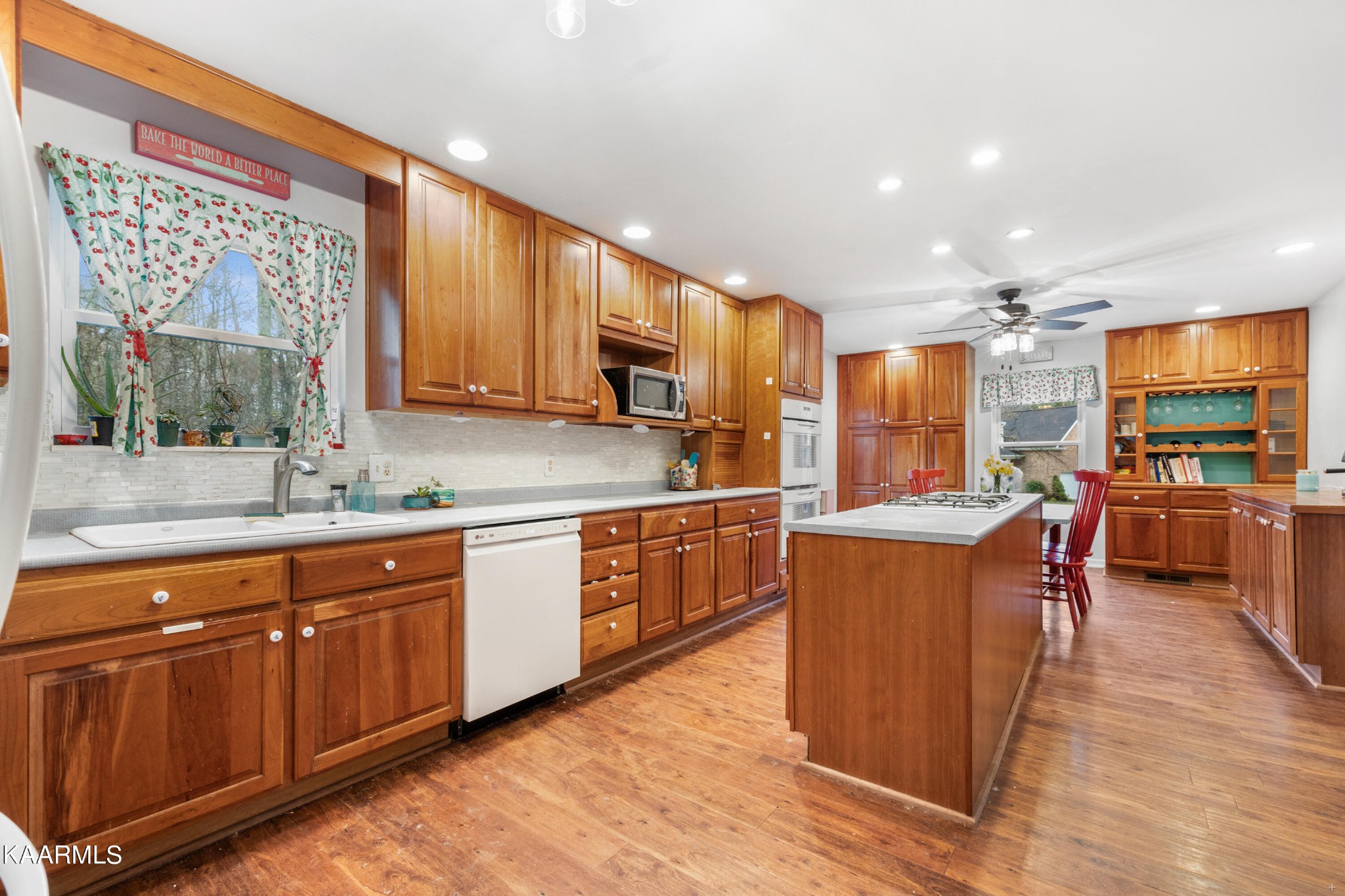 107 Handel Lane Oak Ridge, TN 37830 - Photo 8 of 31 a kitchen with stainless steel appliances granite countertop wooden cabinets a sink and a stove