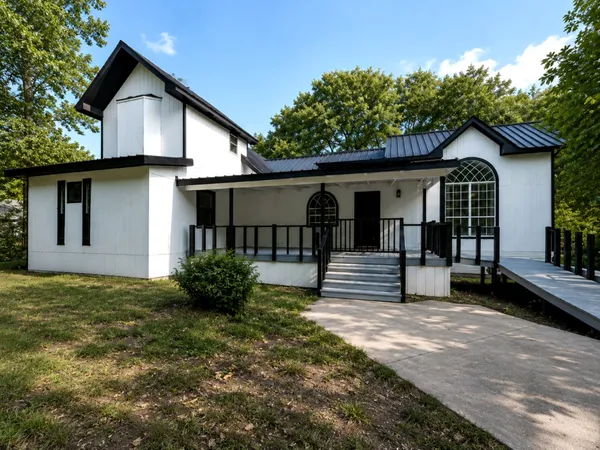 a front view of a house with garden