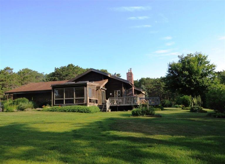 3 Arrowhead Farm Road Truro, MA 02666 - Photo 1 of 35 a front view of house with yard outdoor seating and green space