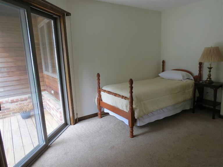 3 Arrowhead Farm Road Truro, MA 02666 - Photo 14 of 35 a bed sitting in a room next to a window