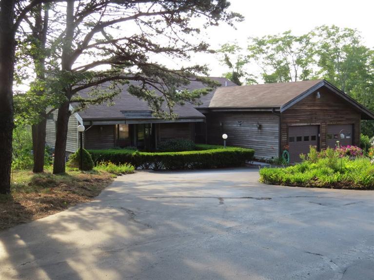 3 Arrowhead Farm Road Truro, MA 02666 - Photo 16 of 35 a front view of a house with a garden