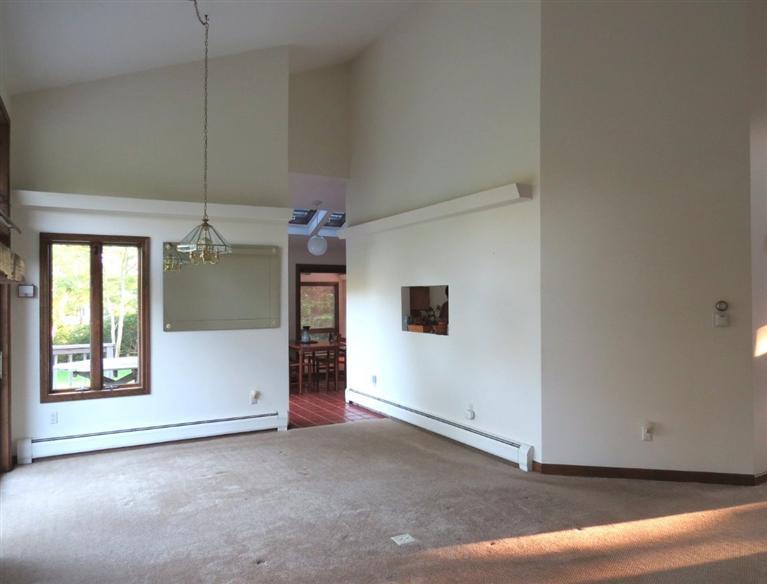 3 Arrowhead Farm Road Truro, MA 02666 - Photo 5 of 35 a view of a livingroom with an empty space and a window