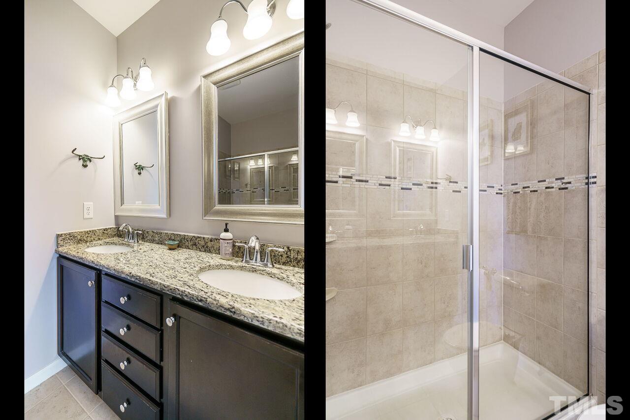 1533 Crafton Way Raleigh, NC 27607 - Photo 20 of 28 a bathroom with a granite countertop sink mirror and shower