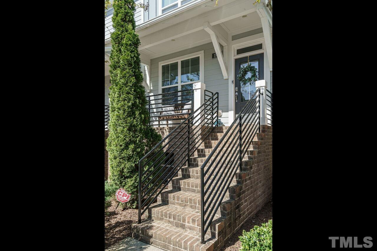 1533 Crafton Way Raleigh, NC 27607 - Photo 3 of 28 a view of balcony with wooden floor and fence