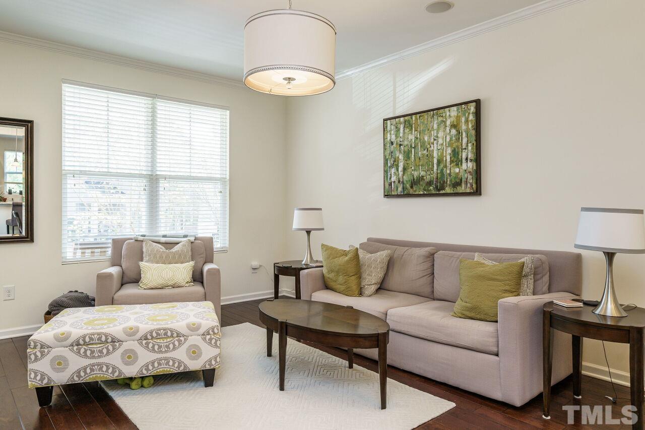 1533 Crafton Way Raleigh, NC 27607 - Photo 6 of 28 a living room with furniture lamp and a window