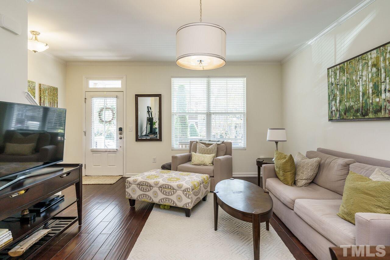 1533 Crafton Way Raleigh, NC 27607 - Photo 7 of 28 a living room with furniture and a flat screen tv