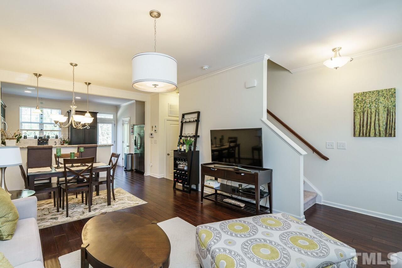 1533 Crafton Way Raleigh, NC 27607 - Photo 9 of 28 a dining room with furniture and wooden floor