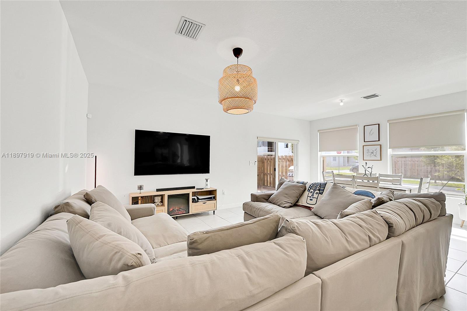 14832 Southwest 265th Street Homestead, FL 33032 - Photo 13 of 43 a living room with furniture and a flat screen tv