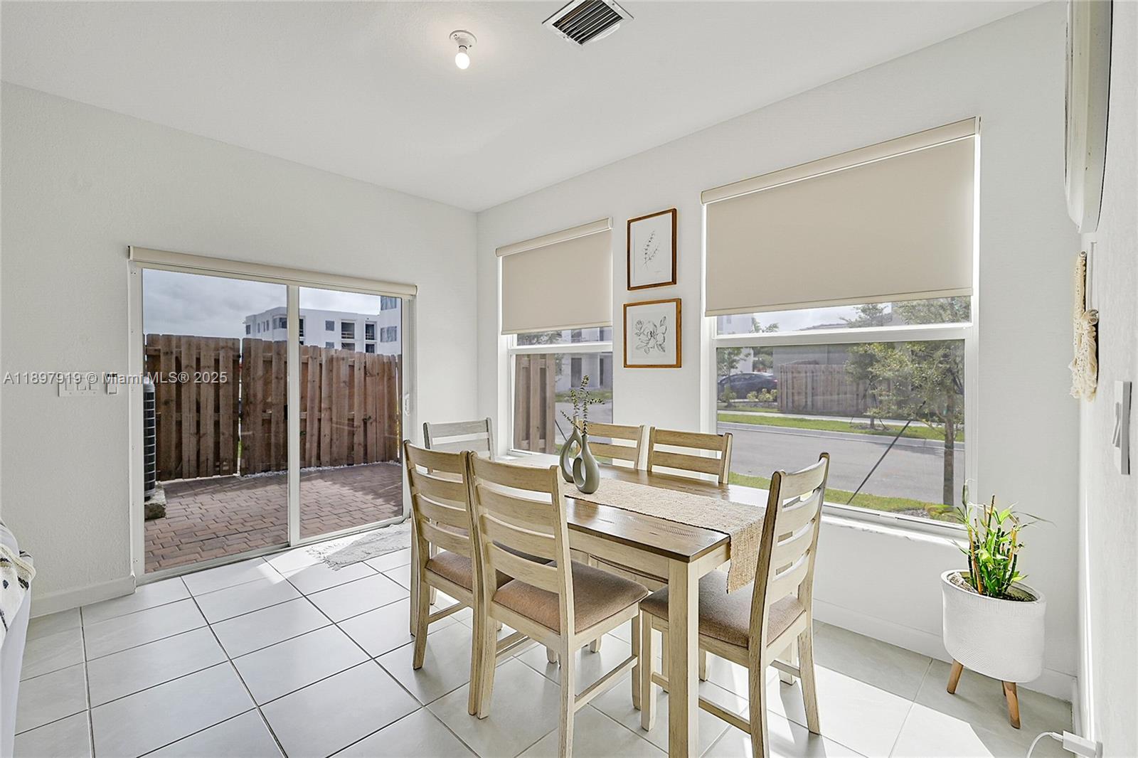 14832 Southwest 265th Street Homestead, FL 33032 - Photo 14 of 43 a dining room with furniture and window