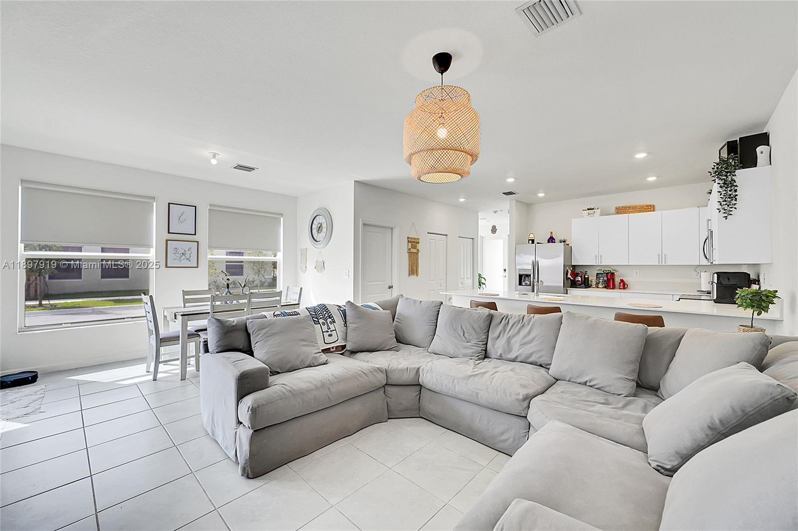 14832 Southwest 265th Street Homestead, FL 33032 - Photo 16 of 43 a living room with furniture and kitchen view