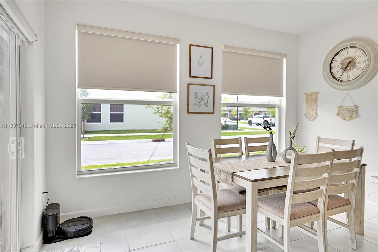14832 Southwest 265th Street Homestead, FL 33032 - Photo 17 of 43 a dining room with furniture and a window
