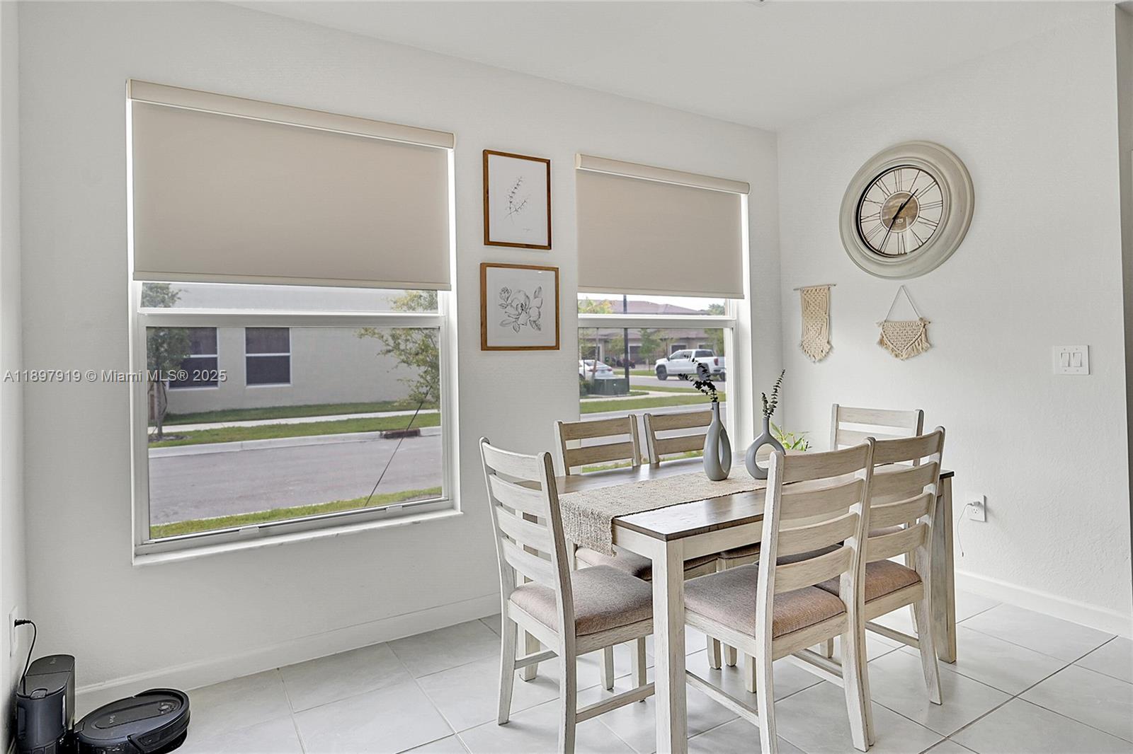 14832 Southwest 265th Street Homestead, FL 33032 - Photo 18 of 43 a dining room with furniture and a window