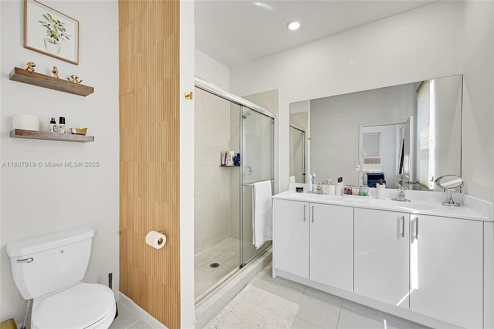 14832 Southwest 265th Street Homestead, FL 33032 - Photo 23 of 43 a bathroom with a sink a toilet and shower