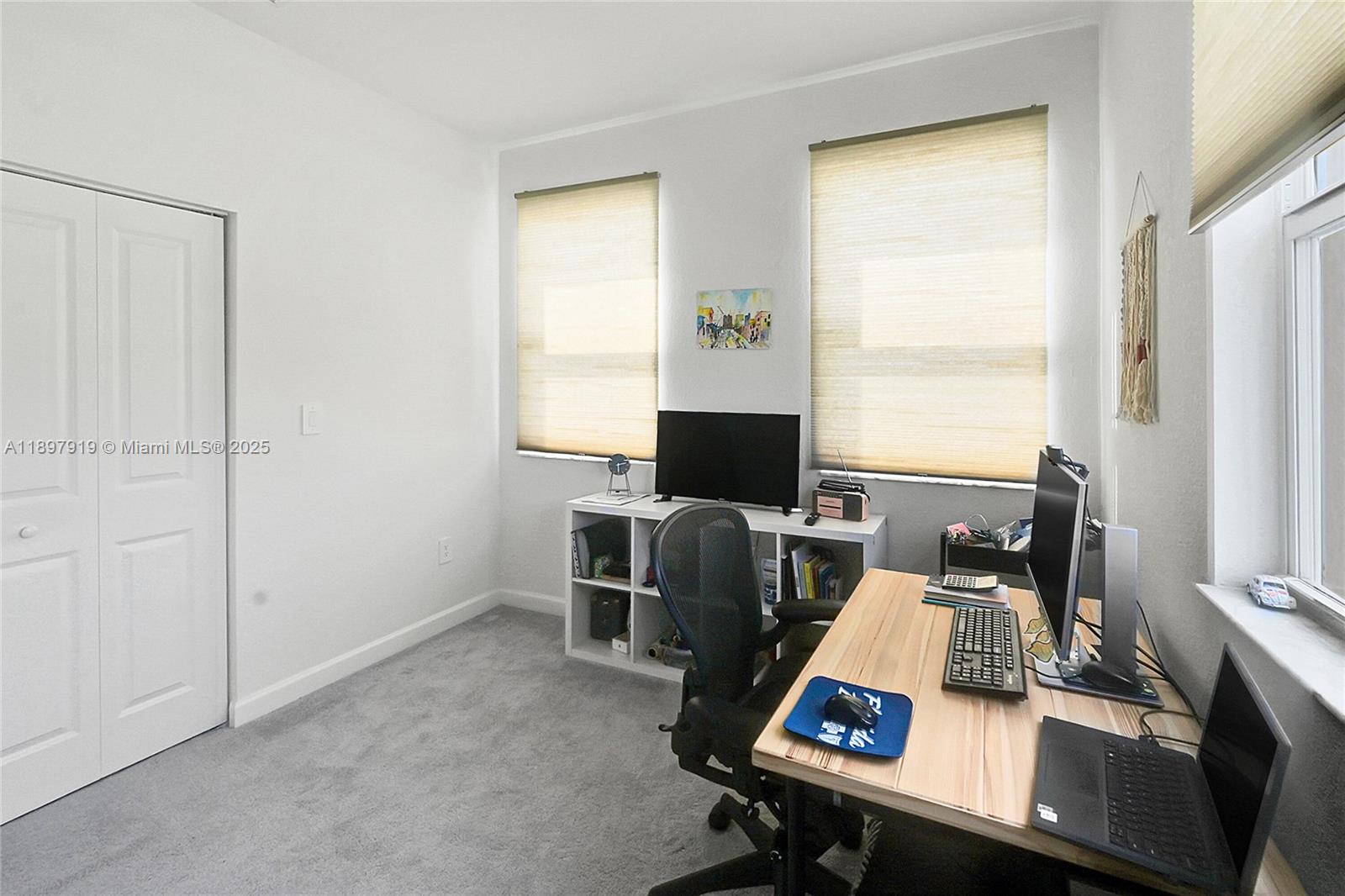 14832 Southwest 265th Street Homestead, FL 33032 - Photo 26 of 43 a view of a workspace with furniture and a window